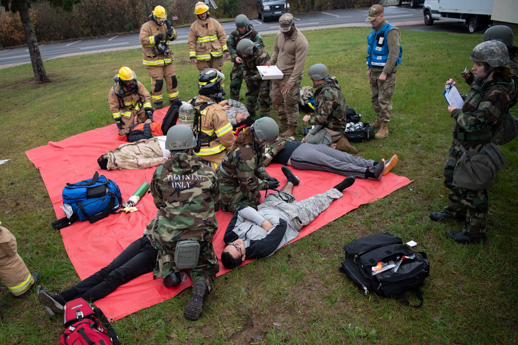 U.S. Air Force Airmen from the 52nd Fighter Wing respond to a simulated mass casualty exercise Nov. 4, 2021, on Spangdahlem Air Base, Germany. 52nd FW hosted exercise Sabre Storm, which tested the readiness and responsiveness of 52nd FW Airmen. (U.S. Air Force photo by Staff Sgt. Melody W. Howley)