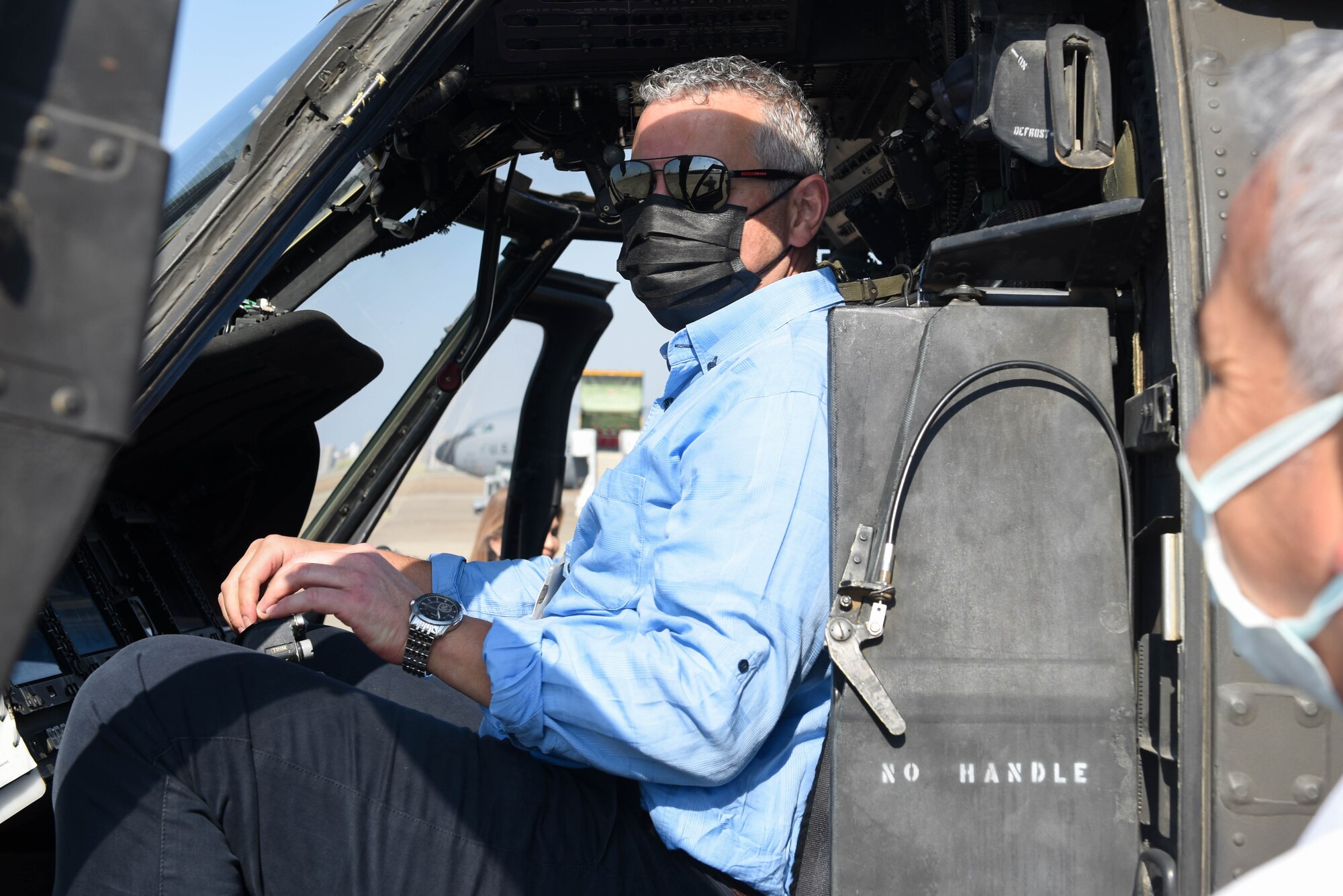 A Turkish medical professional sits in the cockpit of an U.S. Army UH-60 Black Hawk helicopter