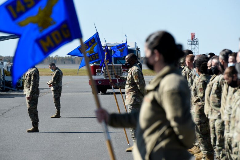 Members of the North Carolina Air National Guard (NCANG) prepare for a ramp formation held at the NCANG Base, Charlotte Douglas International Airport, Nov. 7, 2021. The Ramp Formation is a time-honored tradition at the NCANG in which the 145th Airlift Wing Commander is able to address their Airmen as a whole and incite moral and a better understanding for the mission of the NCANG.