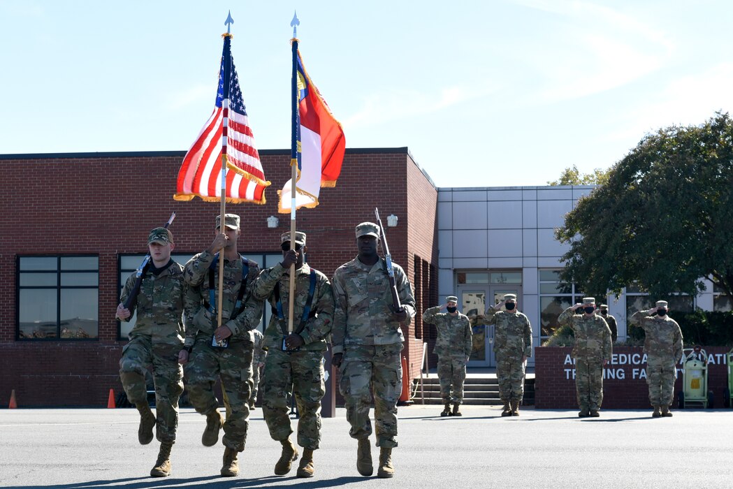 Members of the North Carolina Air National Guard (NCANG) Honor Guard conduct retreat during a ramp formation held at the NCANG Base, Charlotte Douglas International Airport, Nov. 7, 2021. The Ramp Formation is a time-honored tradition at the NCANG in which the 145th Airlift Wing Commander is able to address their Airmen as a whole and incite moral and a better understanding for the mission of the NCANG.