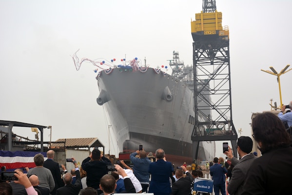 USNS Harvey Milk (T-AO 206) slides into the water during its christening ceremony at General Dynamics NASSCO in San Diego.