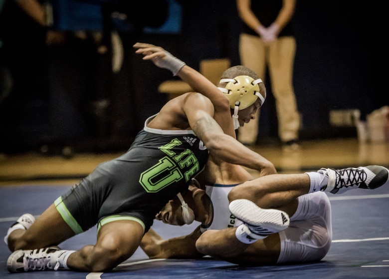 U.S. Marine Corps Cpl. Immanuel Benton competes during a dual wrestling meet at Life University, Marietta, Georgia, 2018. Benton currently serves an operation clerk and supply chief for prior service recruiting at 6th Marine Corps District. (Courtesy photo by DRJ Rodriguez)
