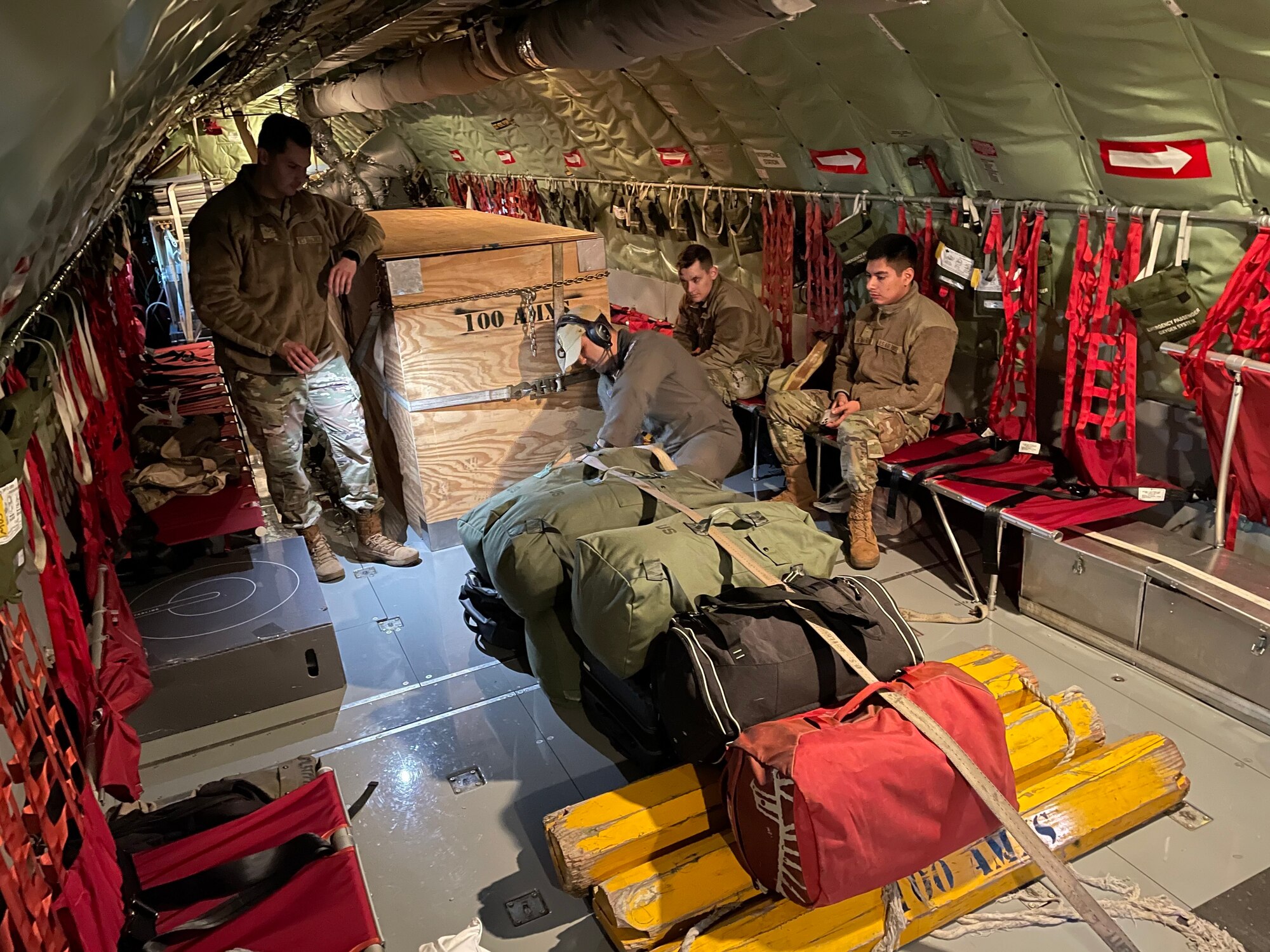 U.S. Airmen assigned to the 100th Air Refueling Wing secure cargo on a KC-135 Stratotanker aircraft during exercise Castle Forge at Royal Air Force Mildenhall, England, Nov. 1, 2021. The ability to quickly respond and reassure allies and partners rests upon the U.S. Air Force’s forward and ready presence in Europe. Alongside F-15 operations in the Black Sea Region, Castle Forge encompasses the USAFE MAJCOM-wide Agile Combat Employment Initial Operating Capability capstone event. Both Castle Forge’s components will better enable forces to quickly disperse and continue to deliver air power from locations with varying levels of capacity and support, ensuring Airmen are always ready to respond to potential threats. (U.S. Air Force photo by Senior Airman Joseph Barron)