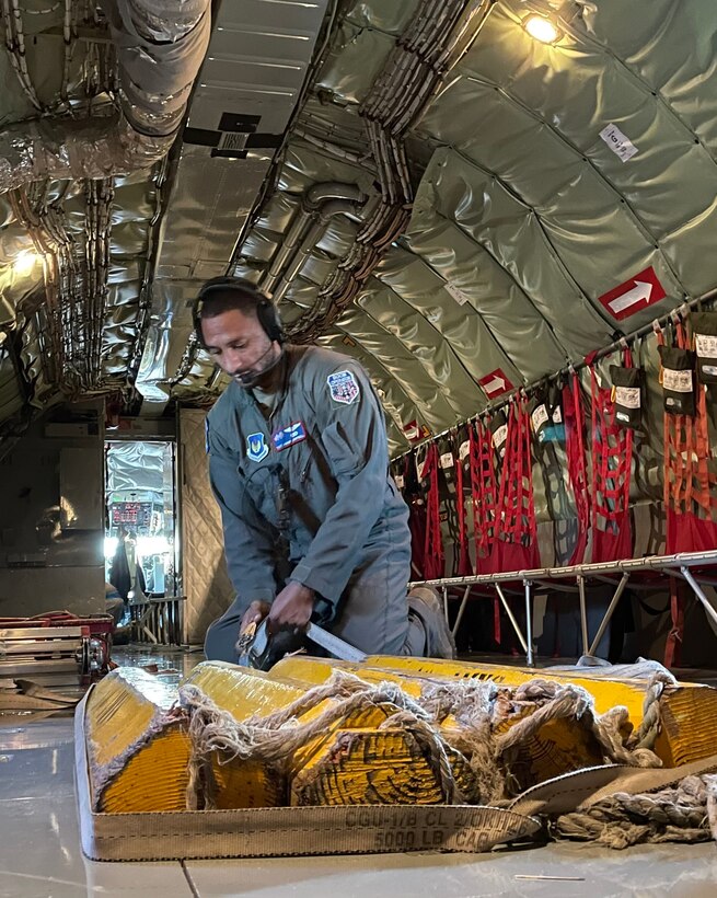 U.S. Air Force Tech. Sgt. Jamar Campbell, 351st Air Refueling Squadron boom operator, secures aircraft wheel chocks on board a KC-135 Stratotanker aircraft prior to flight during exercise Castle Forge at Royal Air Force Fairford, England, Nov. 2, 2021. The U.S. Air Force’s forward-deployed forces are engaged, postured and ready with credible force to assure, deter and defend in an increasingly complex security environment. In addition to F-15 Eagle aircraft operations in the Black Sea Region, Castle Forge encompasses the USAFE-wide Agile Combat Employment capstone event. Castle Forge’s components will better enable forces to quickly disperse and continue to deliver air power from locations with varying levels of capacity and support, ensuring Airmen are always ready to respond to potential threats. (U.S. Air Force photo by Senior Airman Joseph Barron)