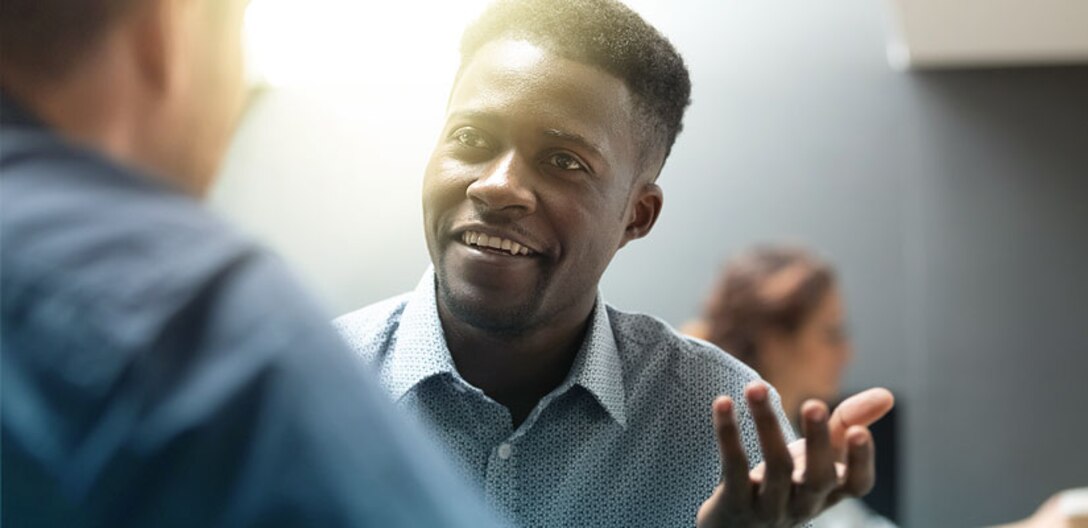 Man talking to another person