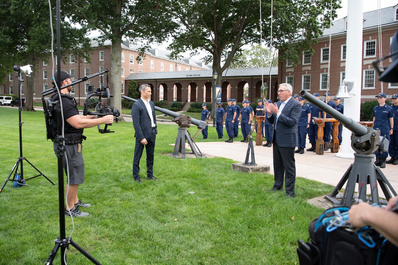 Jim Pitaro, president of ESPN (left) and Sal Paolantonio, ESPN national correspondent (right) during taping on the Washington Parade Field.