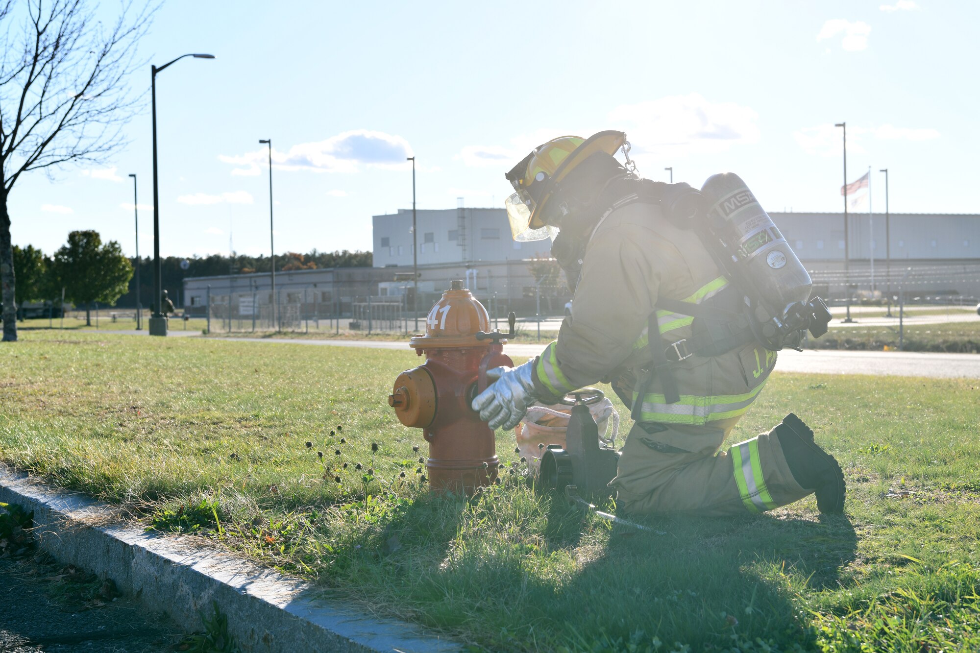 Tech. Sgt. Matthew Annis, firefighter with the 104th Civil Engineer Squadron, attaches a hose to a fire hydrant during a midpoint inspection on November 5, 2021 at Barnes Air National Guard Base, Westfield MA. Midpoint inspections are conducted to evaluate the wing’s capabilities to respond to threats in a contested, degraded, and operationally limited environment. (U.S. Air National Guard photo by Senior Airman Camille Lienau)