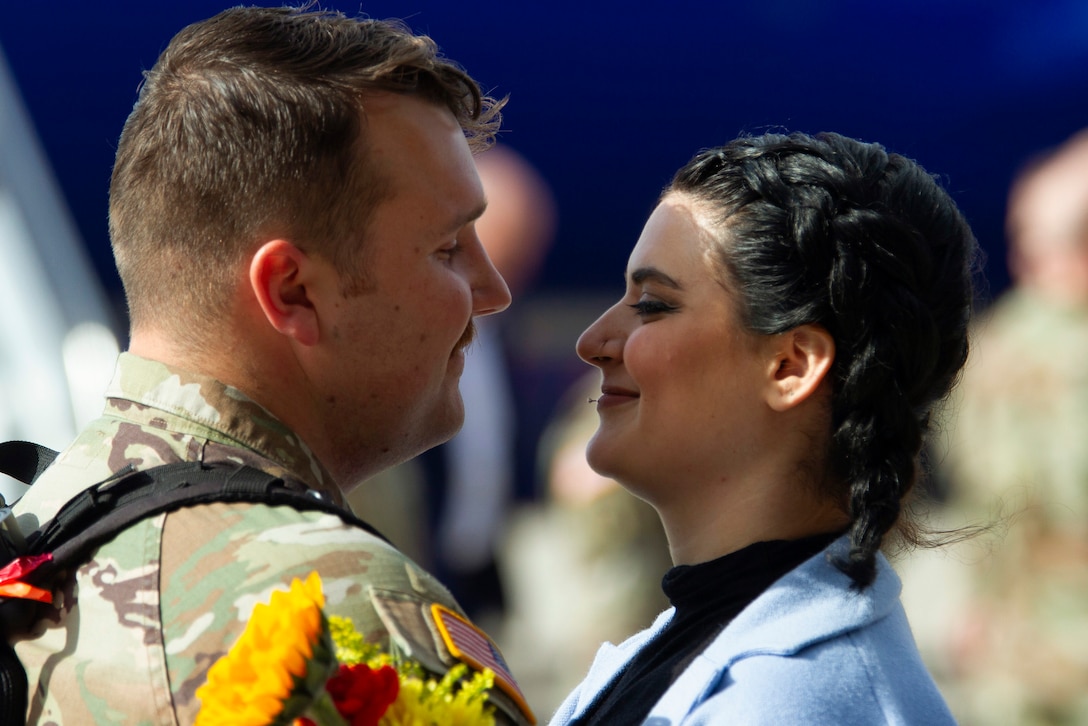 A National Guardsman locks eyes with a loved one.