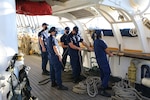 The crew of the U.S. Coast Guard Cutter Eagle make preparations to get underway in Portsmouth, Virginia, Sept. 20, 2021. The vessel spent three days in port providing tours for members of the public, military and first responders. (U.S. Coast Guard photo by Petty Officer 2nd Class Paige Hause)