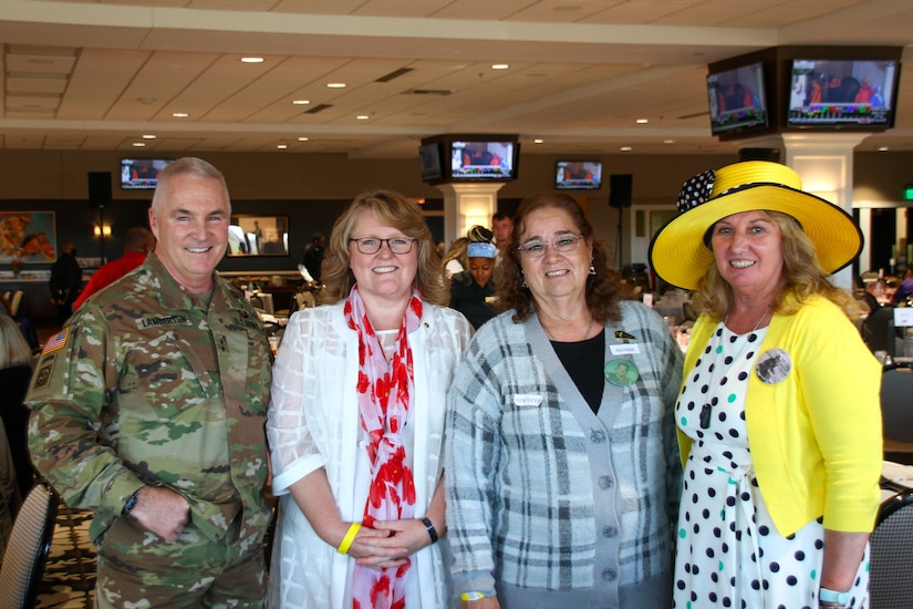 Maj. Gen. Hal B. Lamberton, the Adjutant General of Kentucky, poses for a photograph with Gold Star Family members at the Survivor Outreach Services Day at the Races at Churchill Downs in Louisville, Ky. Nov. 7, 2021. Survivor Outreach Services Day at the Races is an annual event held to honor the lives of fallen services members. (U.S. Army National Guard photo by Sgt. Matt Damon)