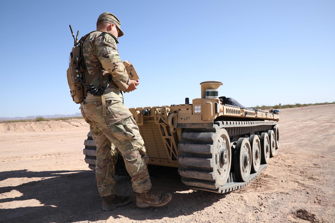 A soldier operates an unmanned ground vehicle.