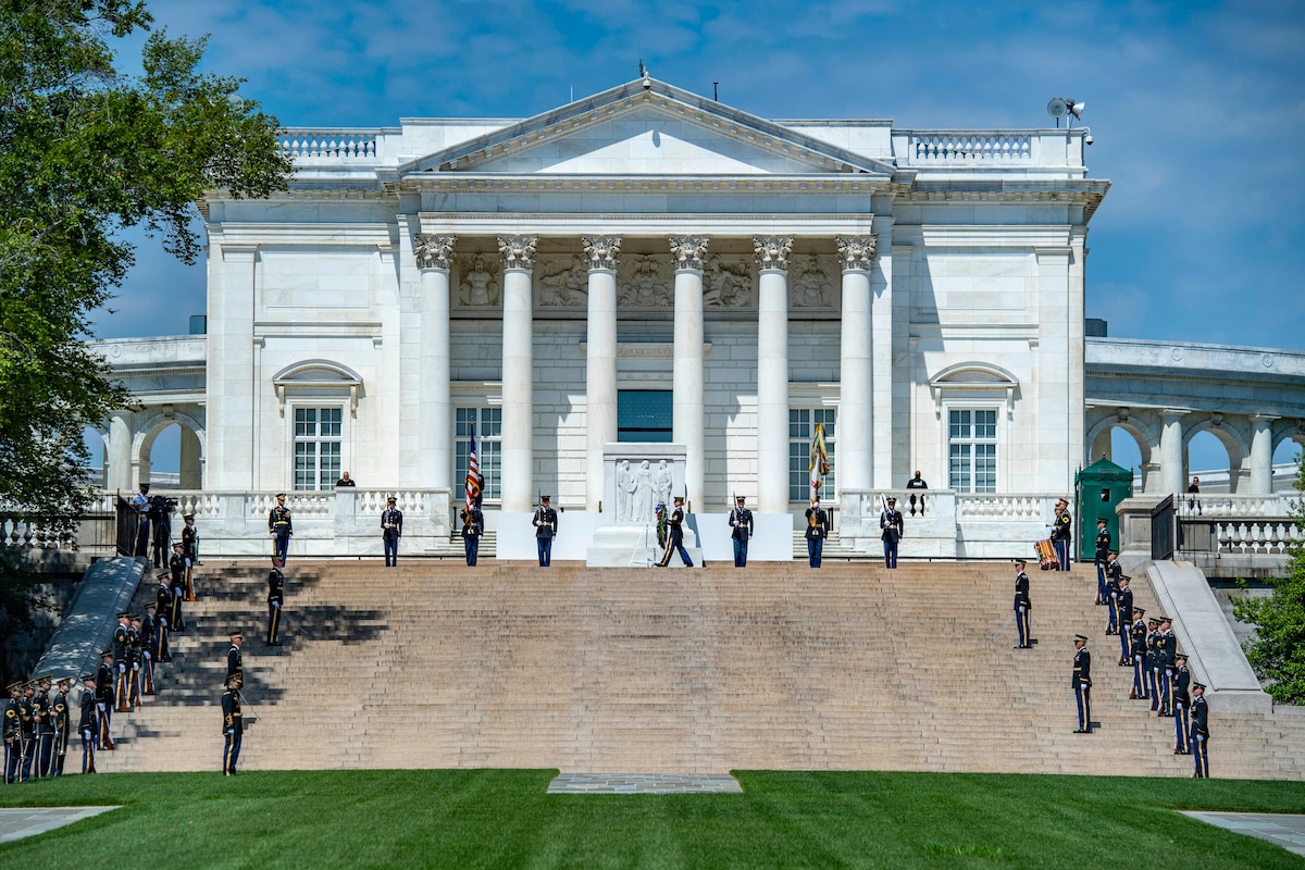 Soldiers gathering on steps around the Tomb of the Unknown Soldier.