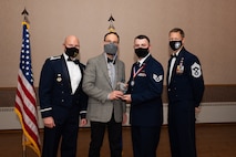 U.S. Air Force Staff Sgt. Beaux Hebert, a 354th Fighter Wing Public Affairs mass communication journeyman, receives the Academic Achievement Award during the Airman Leadership School (ALS) Class 22-1 graduation ceremony on Eielson Air Force Base, Alaska, Nov. 5, 2021.