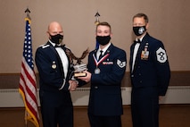U.S. Air Force Staff Sgt. Thomas Urbany, a 354th Healthcare Operations Squadron paramedic, receives the Commandant Award during the Airman Leadership School (ALS) Class 22-1 graduation ceremony on Eielson Air Force Base, Alaska, Nov. 5, 2021.