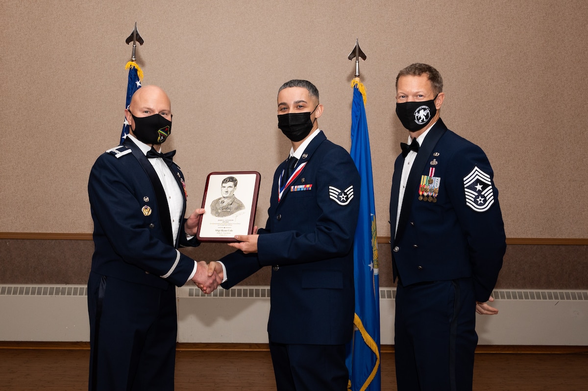 U.S. Air Force Staff. Sgt. Ryan Cole, a 354th Operational Medical Readiness Squadron bioenvironmental engineering technician, receives the John L. Levitow Award during the Airman Leadership School (ALS) Class 22-1 graduation ceremony on Eielson Air Force Base, Alaska, Nov. 5, 2021.