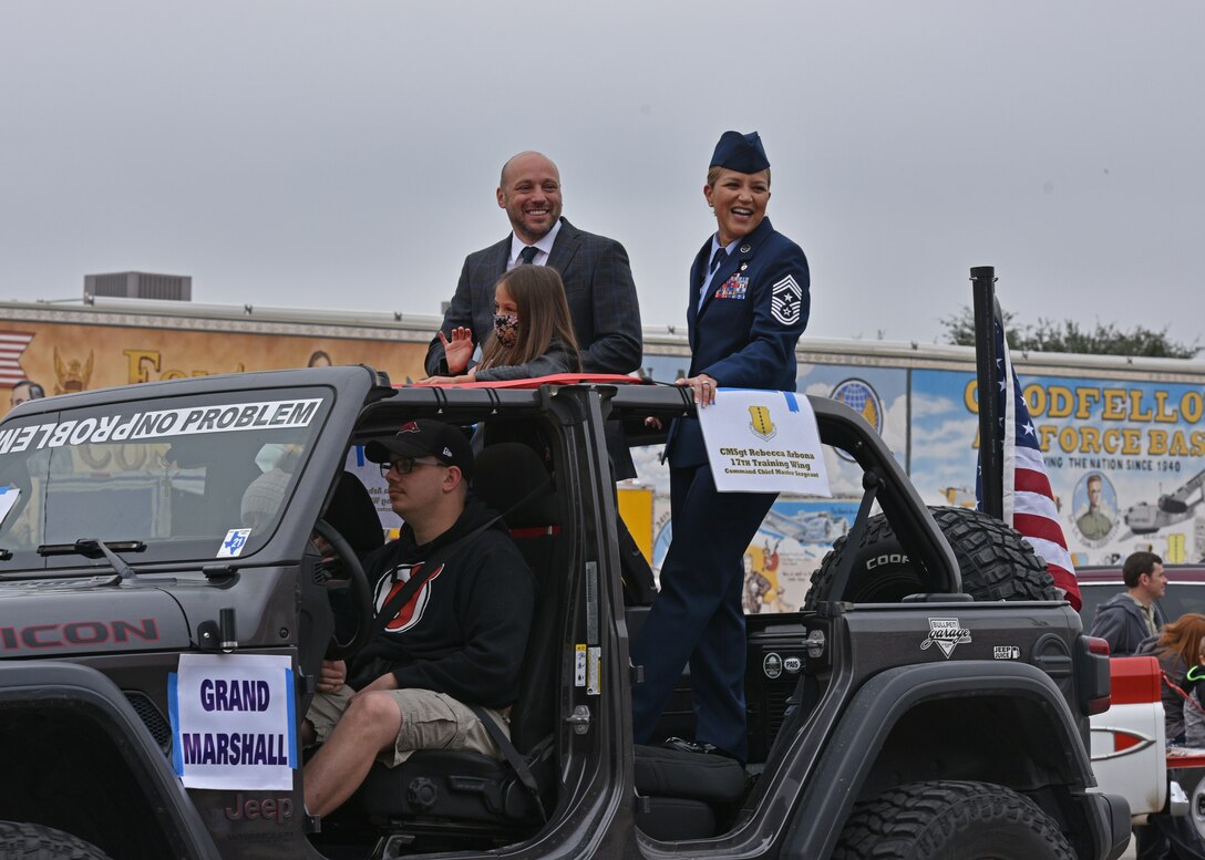 U.S. Air Force Chief Master Sgt. Rebecca Arbona, 17th Training Wing command chief, rides in a vehicle during the Veterans Day Parade in downtown San Angelo, Texas, Nov. 6, 2021. Veterans from several wars, military supporters, local schools, and clubs took part in the parade to honor those who have served. (U.S. Air Force photo by Senior Airman Ashley Thrash)