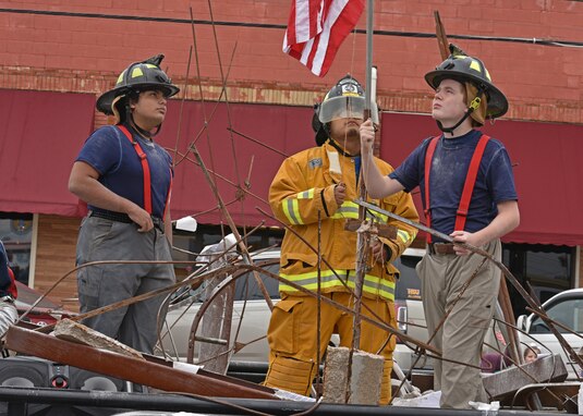 Members from Ambleside School of San Angelo re-enact the firefighters who worked on Sept. 9, 2001, in the Veteran’s Day Parade in downtown San Angelo, Texas, Nov. 6, 2021. The Ambleside float won first place in the float competition. (U.S. Air Force photo by Senior Airman Ashley Thrash)