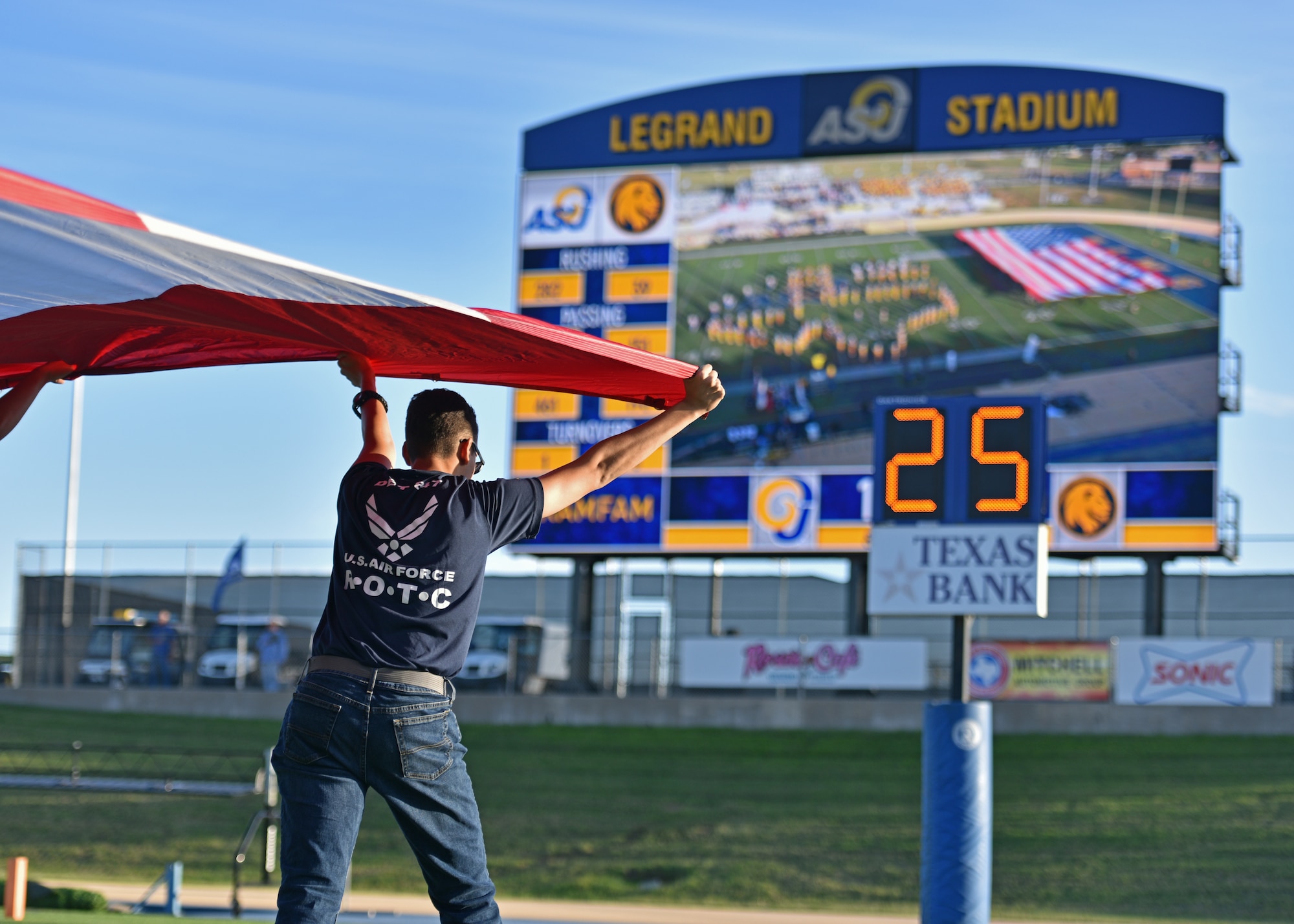 A cadet from Angelo State University’s ROTC detachment 847 held the American flag during the Military Appreciation Night at the 1st Community Credit Union Field, Nov. 6, 2021. Volunteers from the detachment held the National Flag during the National Anthem before the game kicked off. (U.S. Air Force photo by Senior Airman Ashley Thrash)