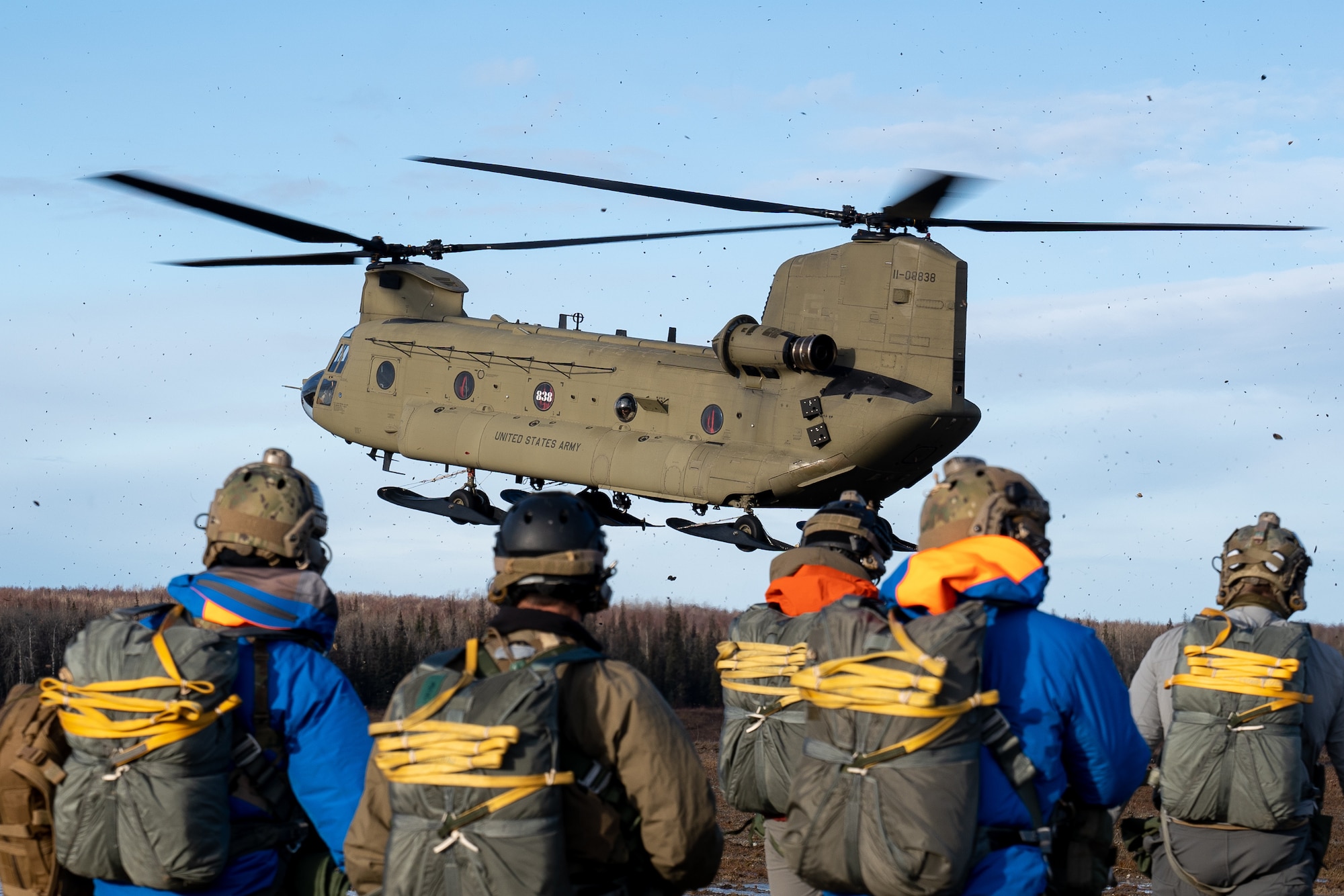 A U.S. Army National Guard CH-47F Chinook operated by Detachment 1, Bravo Company, 2-211th General Service Aviation Battalion, picks up U.S. Air Force pararescuemen assigned to the 212th Rescue Squadron, Alaska Air National Guard, during a training event at Joint Base Elmendorf-Richardson, Alaska.