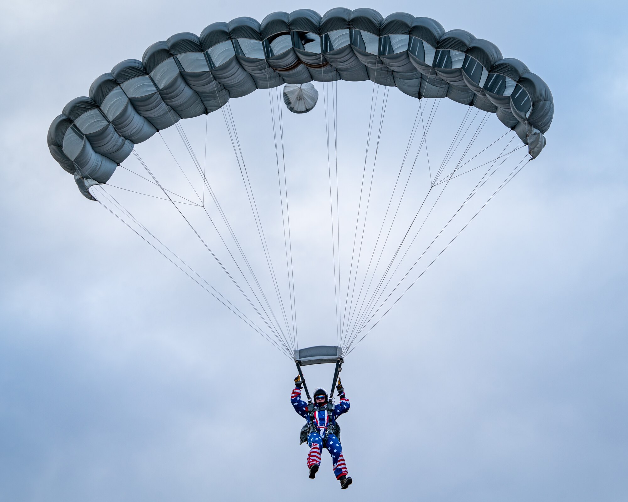 U.S. Air Force Staff Sgt. Daniel Stikeleather, a pararescueman assigned to the 212th Rescue Squadron, Alaska Air National Guard, descends upon Malemute Drop Zone during a training event at Joint Base Elmendorf-Richardson.