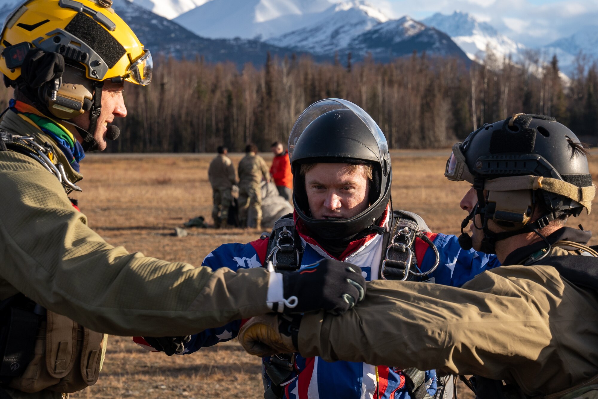 U.S. Air Force pararescuemen assigned to the 212th Rescue Squadron, Alaska Air National Guard, practice freefall procedures before jumping during a training event at Joint Base Elmendorf-Richardson.