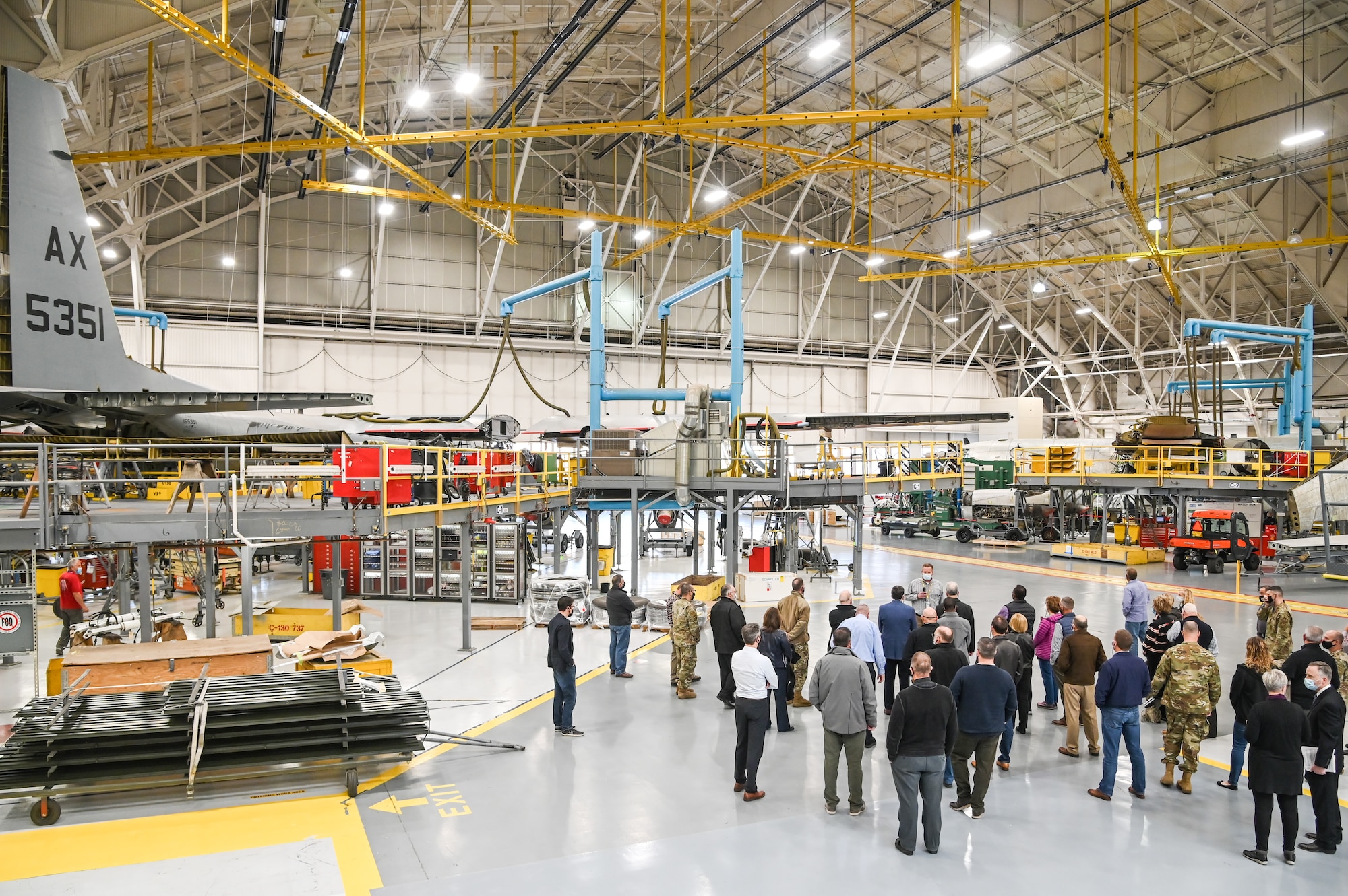 Community leaders with the Air and Space Force Civic Leader Program are briefed about Ogden Air Logistics Complex C-130 maintenance.