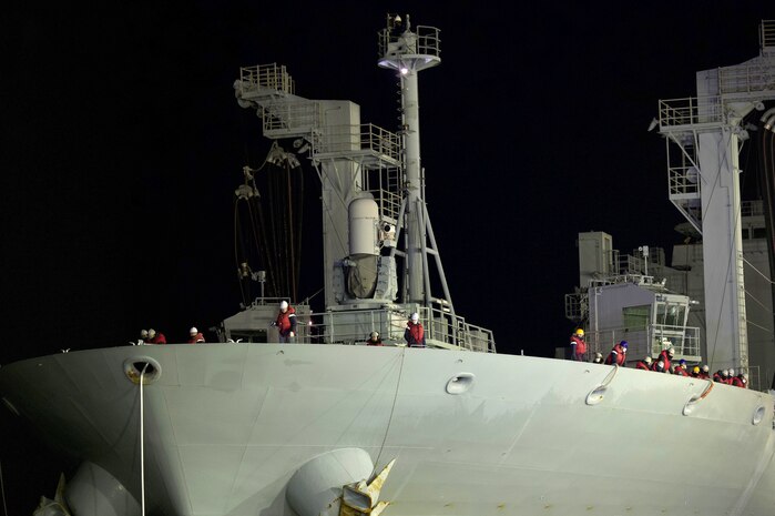 Midshipmen from the Republic of Korea Navy (ROKN) Cruise Training Task Group’s two vessels, a Republic of Korea Ship (ROKS) Wang Geon (DDH-978) Chungmugyon Yi Sun-sin-sin-class destroyer and ROKS So Yan (AOE-51), a combat support ship, watch as an F-22 Raptors passes by at the Port of Alaska, Anchorage, Nov. 4, 2021. The ROKN Cruise Training Task Group visited Alaska during a 67-day voyage, which marked the first ever trip for ROKN vessels to the state.(U.S. Air Force photo by Sheila deVera)