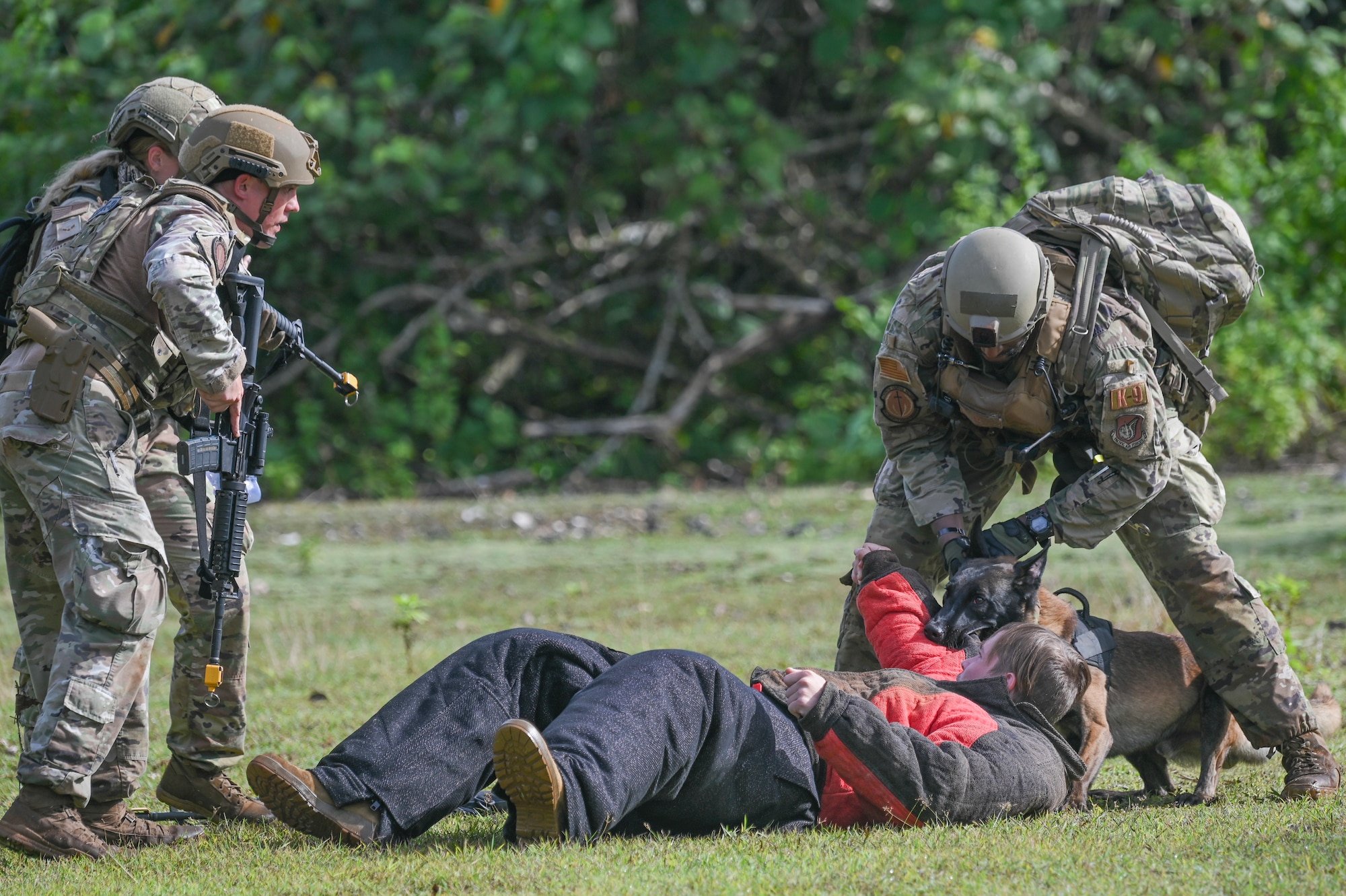 Airmen searching a suspect.