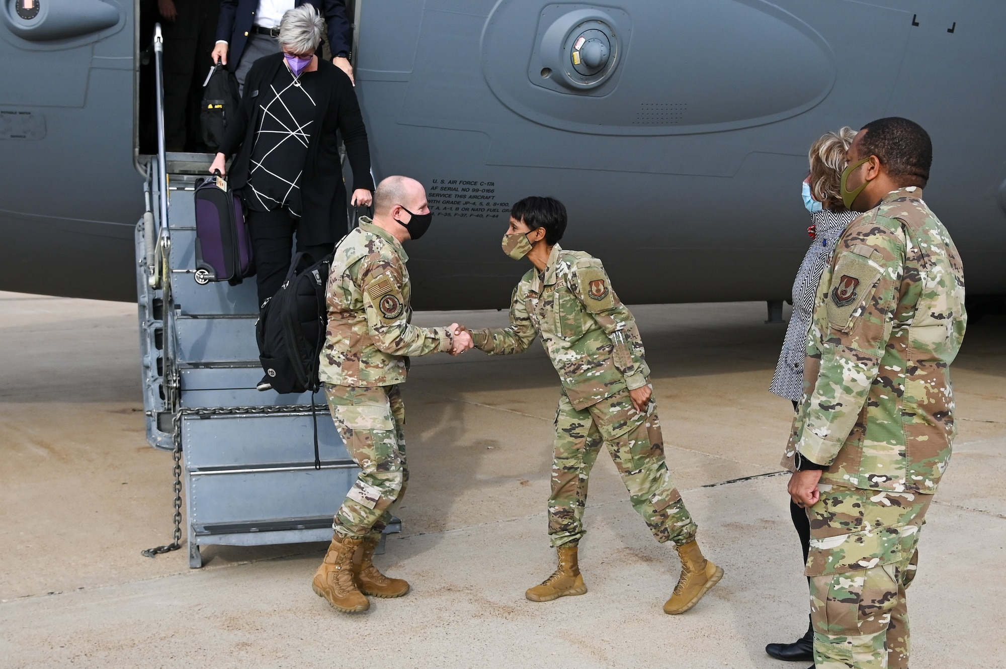 Lt. Gen. Carl Schaefer, Air Force Material Command deputy commander, greets Col. Jenise Carroll, 75th Air Base Wing commander,