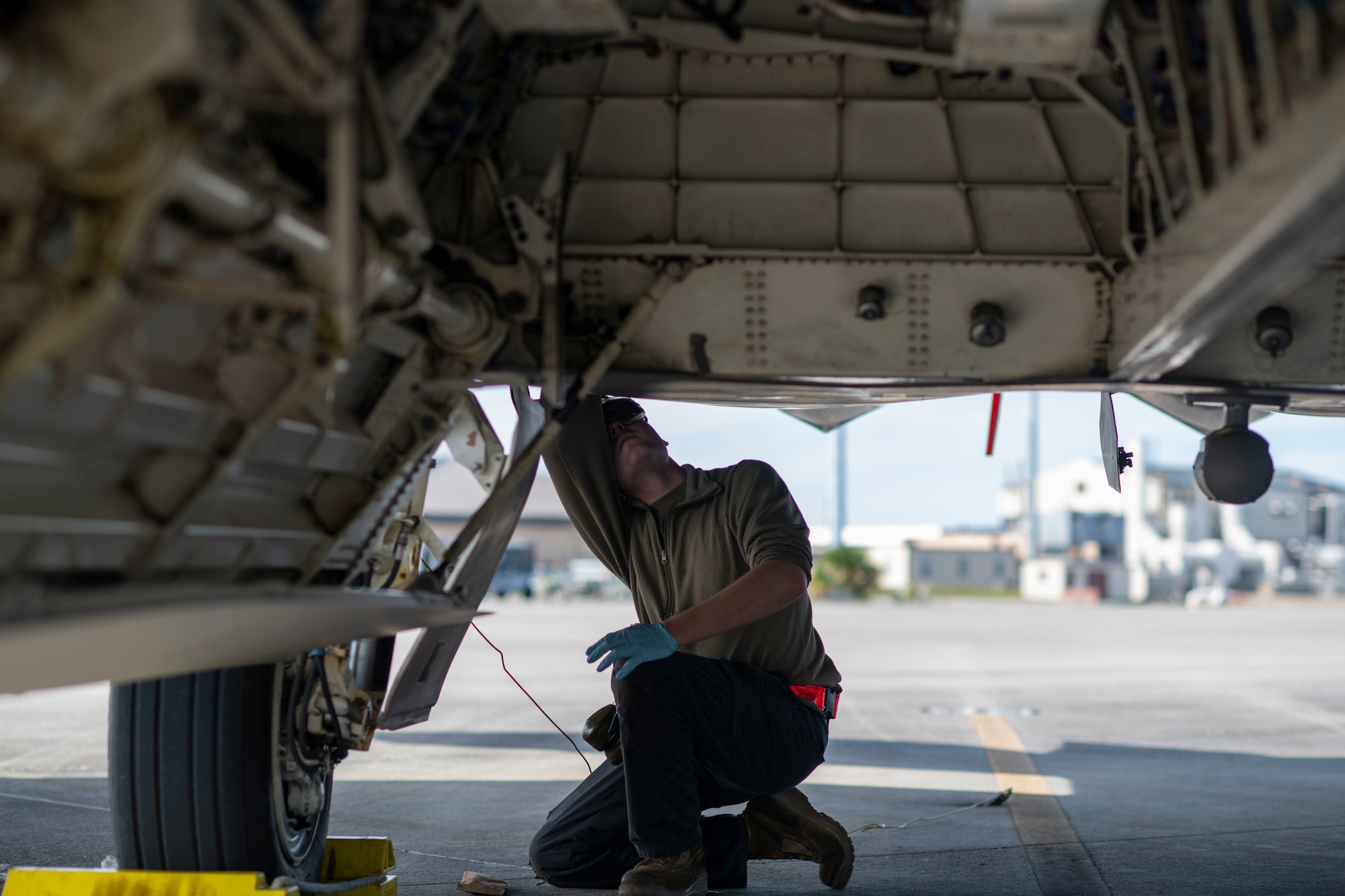 man inspecting plane