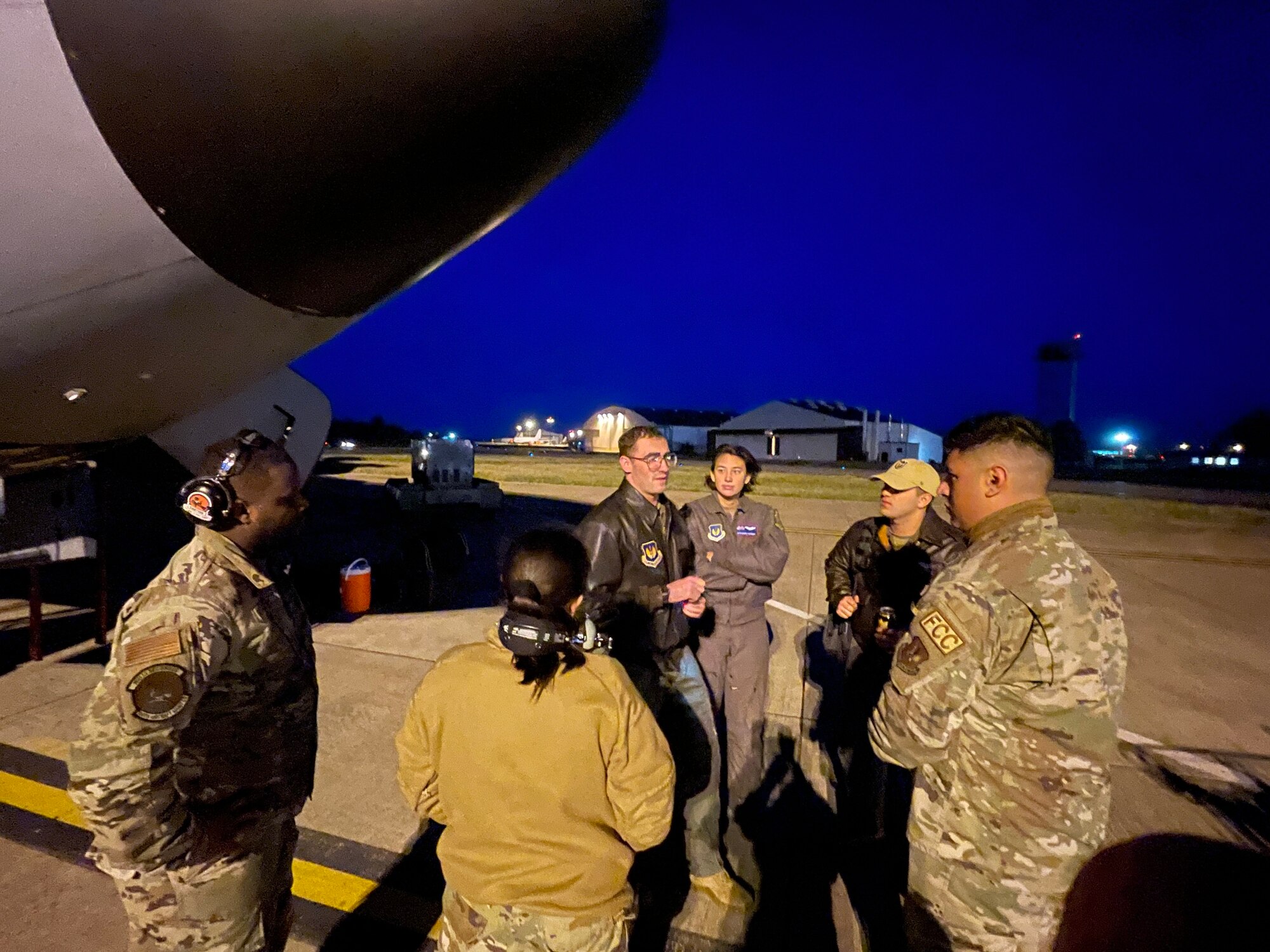 U.S. Airmen assigned to the 100th Air Refueling Wing discuss safety measures before a refueling mission during exercise Castle Forge at Royal Air Force Mildenhall, England, Nov. 1, 2021. The ability to quickly respond and reassure allies and partners rests upon the U.S. Air Force’s forward and ready presence in Europe. Alongside F-15 operations in the Black Sea Region, Castle Forge encompasses the USAFE MAJCOM-wide Agile Combat Employment Initial Operating Capability capstone event. Both Castle Forge’s components will better enable forces to quickly disperse and continue to deliver air power from locations with varying levels of capacity and support, ensuring Airmen are always ready to respond to potential threats. (U.S. Air Force photo by Senior Airman Joseph Barron)