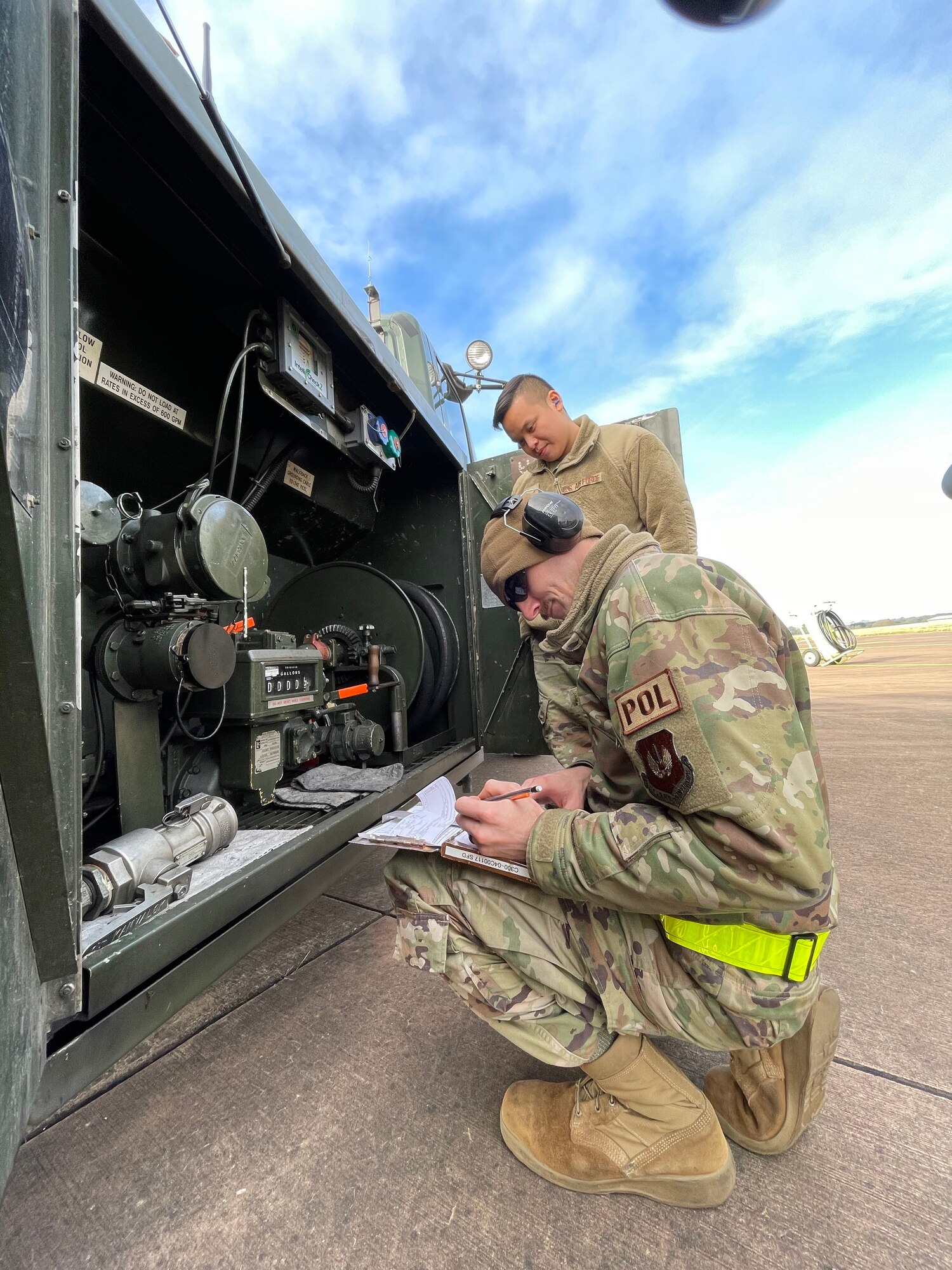 U.S. Air Force Airman 1st Class Taylor Williford, right, 100th Logistics Readiness Squadron fuels journeyman, accounts for diesel fuel while Senior Airman Arnuphap Parakawongnaayutdhaya, 100th LRS fuels journeyman, verifies his work during exercise Castle Forge at Royal Air Force Fairford, England, Nov. 3, 2021. Exercising elements of Agile Combat Employment enables U.S. forces in Europe to operate from locations with varying levels of capacity and support, ensuring Airmen and aircrews are postured to deliver lethal combat power across the spectrum of military operations. In addition to F-15 Eagle aircraft operations in the Black Sea Region, Castle Forge encompasses the USAFE-wide ACE capstone event. Castle Forge’s components will better enable forces to quickly disperse and continue to deliver air power from locations with varying levels of capacity and support, ensuring Airmen are always ready to respond to potential threats. (U.S. Air Force photo by Senior Airman Joseph Barron)
