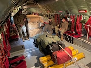 U.S. Airmen assigned to the 100th Air Refueling Wing secure cargo on a KC-135 Stratotanker aircraft during exercise Castle Forge at Royal Air Force Mildenhall, England, Nov. 1, 2021. The ability to quickly respond and reassure allies and partners rests upon the U.S. Air Force’s forward and ready presence in Europe. Alongside F-15 operations in the Black Sea Region, Castle Forge encompasses the USAFE MAJCOM-wide Agile Combat Employment Initial Operating Capability capstone event. Both Castle Forge’s components will better enable forces to quickly disperse and continue to deliver air power from locations with varying levels of capacity and support, ensuring Airmen are always ready to respond to potential threats. (U.S. Air Force photo by Senior Airman Joseph Barron)