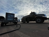 U.S. Airmen assigned to the 100th Air Refueling Wing fill an aerospace ground equipment power cart with diesel fuel during exercise Castle Forge at Royal Air Force Fairford, England, Nov. 3, 2021. The U.S. Air Force’s forward-deployed forces are engaged, postured and ready with credible force to assure, deter and defend in an increasingly complex security environment. In addition to F-15 Eagle aircraft operations in the Black Sea Region, Castle Forge encompasses the USAFE-wide Agile Combat Employment capstone event. Castle Forge’s components will better enable forces to quickly disperse and continue to deliver air power from locations with varying levels of capacity and support, ensuring Airmen are always ready to respond to potential threats. (U.S. Air Force photo by Senior Airman Joseph Barron)