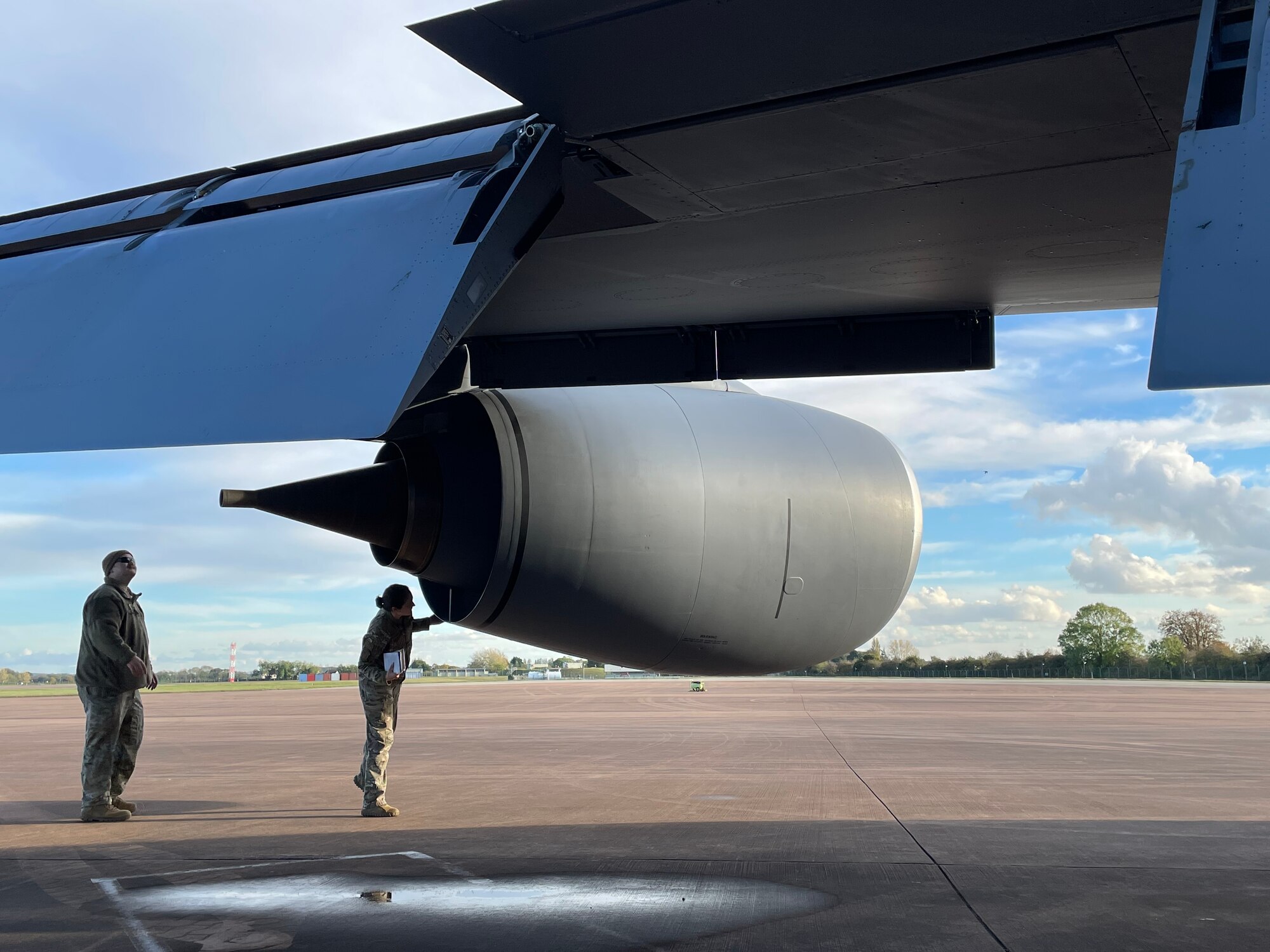 U.S. Air Force Staff Sgt. Benjamin Kellum, left, 100th Aircraft Maintenance Squadron flying crew chief, and Capt. Kelly Hightaian, 351st Air Refueling Squadron pilot, perform a preflight walk-around of a KC-135 Stratotanker aircraft during exercise Castle Forge at Royal Air Force Fairford, England, Nov. 2, 2021. Exercising elements of Agile Combat Employment enables U.S. forces in Europe to operate from locations with varying levels of capacity and support, ensuring Airmen and aircrews are postured to deliver lethal combat power across the spectrum of military operations. In addition to F-15 Eagle aircraft operations in the Black Sea Region, Castle Forge encompasses the USAFE-wide ACE capstone event. Castle Forge’s components will better enable forces to quickly disperse and continue to deliver air power from locations with varying levels of capacity and support, ensuring Airmen are always ready to respond to potential threats. (U.S. Air Force photo by Senior Airman Joseph Barron)