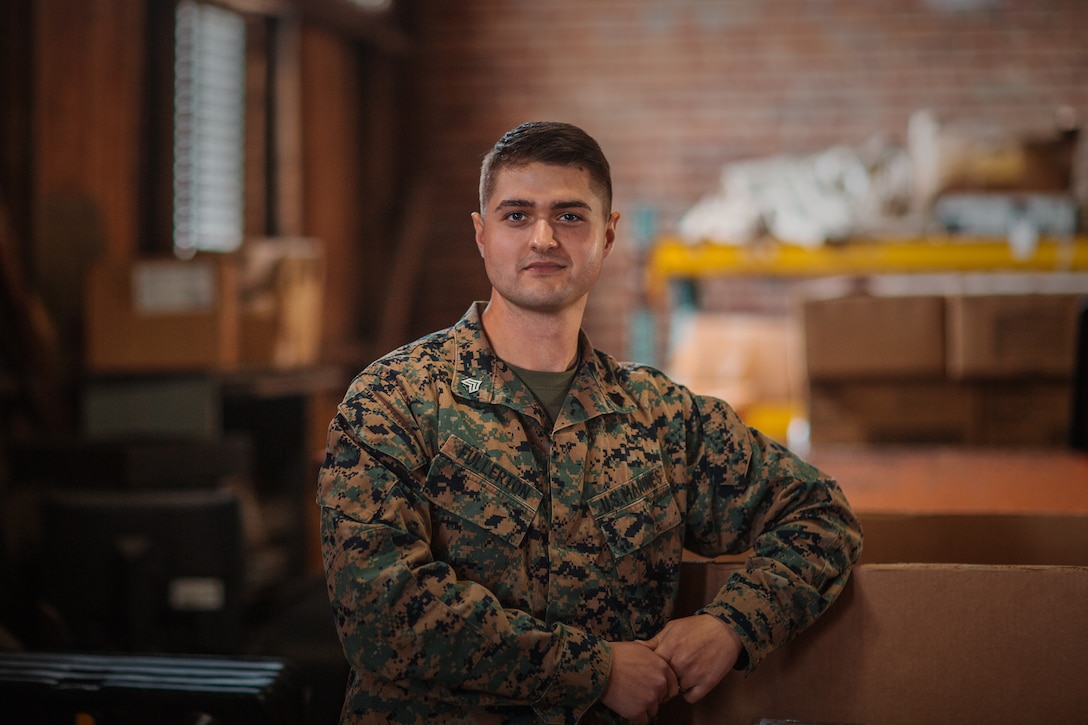 U.S. Marine Corps Sgt. Chase Fullerton, a supply chain and material management specialist with the 26th Marine Expeditionary Unit, poses for a photograph on Fort Pickett, Virginia, Nov. 3, 2021. Fullerton was recognized as the motivator of the week for his part in the procurement of essential supplies and gear at Fort Pickett. As the supply NCOIC, he is responsible for the distribution of items to Afghan guests and other units supporting Operation Allies Welcome. “I feel a sense of accomplishment when I am able to help the Afghan guests here at Fort Pickett. The work we are doing out here is important and I feel honored to be a part of it” Said Fullerton. (U.S. Marine Corps Photo by Lance Cpl. Zachary Zephir)