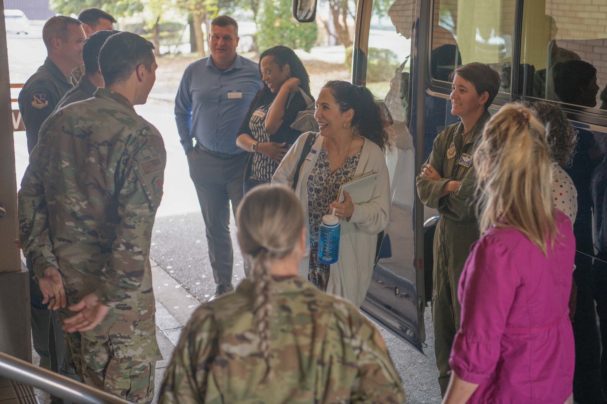 Dr. Doniel Wolfe, center, spouse of U.S. Air Force Chief Master Sgt. David Wolfe, Pacific Air Forces command chief, speaks to the Yokota COVID Response Team (CRT) at one of the base’s COVID-19 contingency towers during a visit to Yokota Air Base