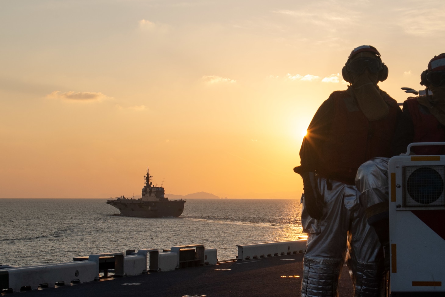 EAST CHINA SEA (Nov. 3, 2021) The forward-deployed amphibious assault ship USS America (LHA 6) sails in formation with the Japan Maritime Self-Defense Force ship JS Ise (DDH 182). America, lead ship of the America Amphibious Ready Group, is operating in the U.S. 7th Fleet area of responsibility to enhance interoperability with allies and partners and serve as a ready response force to defend peace and stability in the Indo-Pacific region. (U.S. Navy photo by Mass Communication Specialist 2nd Class Shelby Tucker)