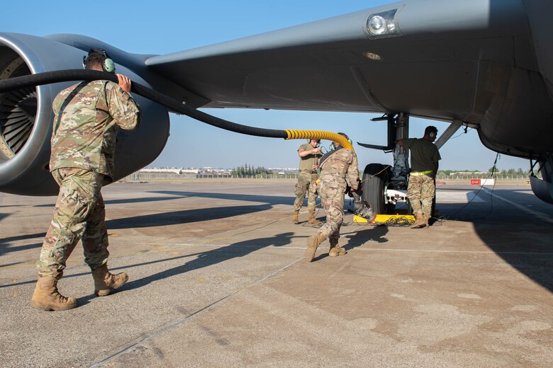 POL Airmen pulling fuel hose to KC-135 Stratotanker