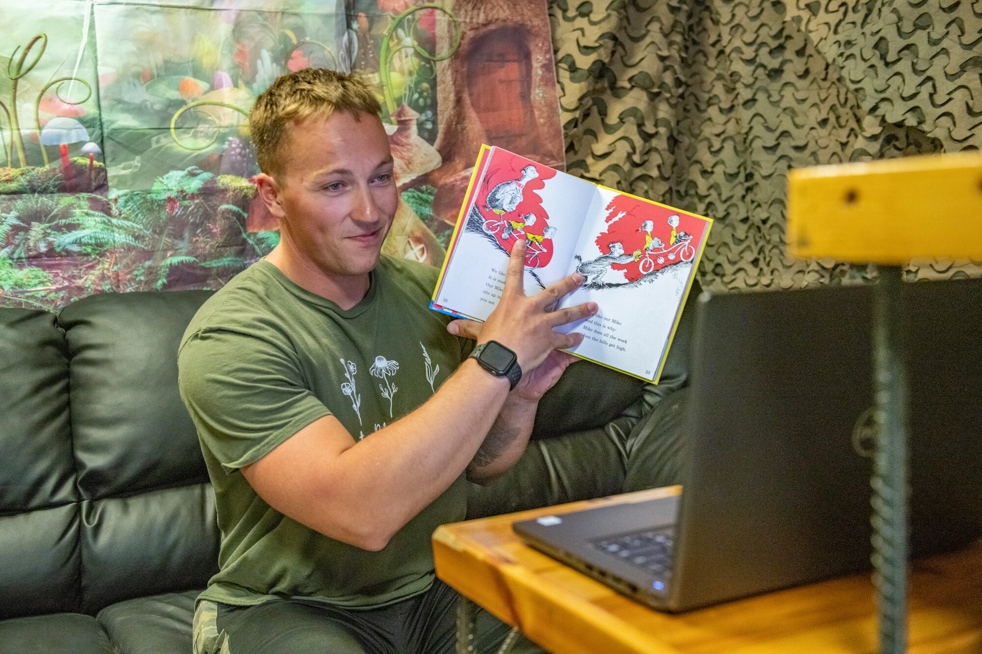 U.S. Air Force Staff Sgt. Alex Deering, 332nd Expeditionary Civil Engineer Squadron firefighter, records himself reading, “One Fish, Two Fish, Red Fish, Blue Fish” for the Bob Hope Legacy Reading Program