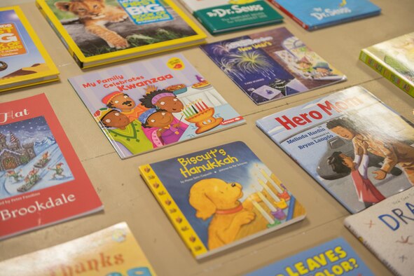 United Service Organizations members lay out books for Airmen to pick out for the Bob Hope Legacy Reading Program