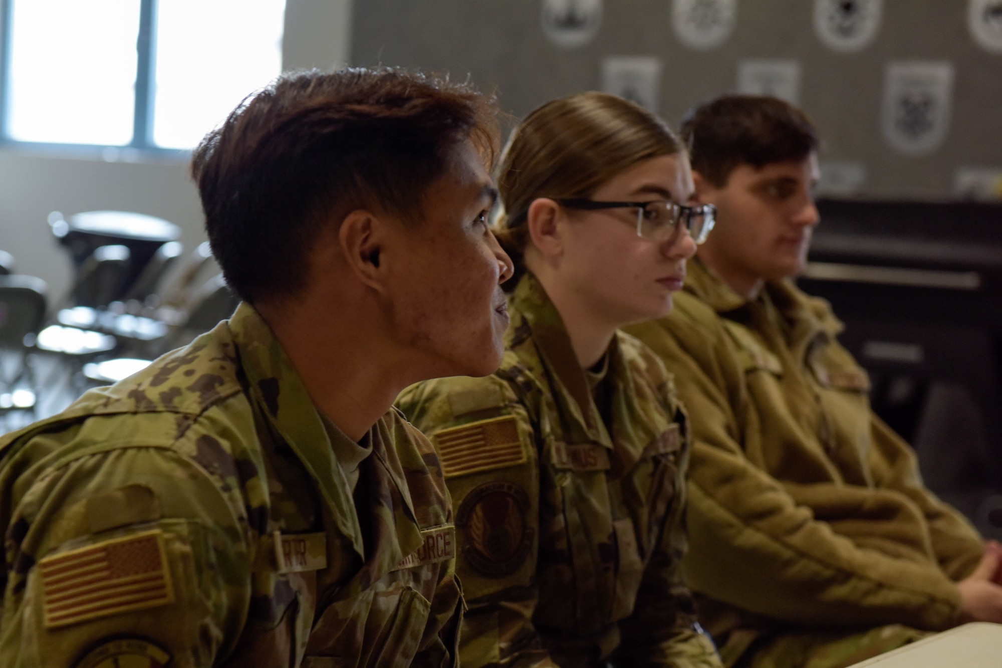 Three people participate in a mentoring session