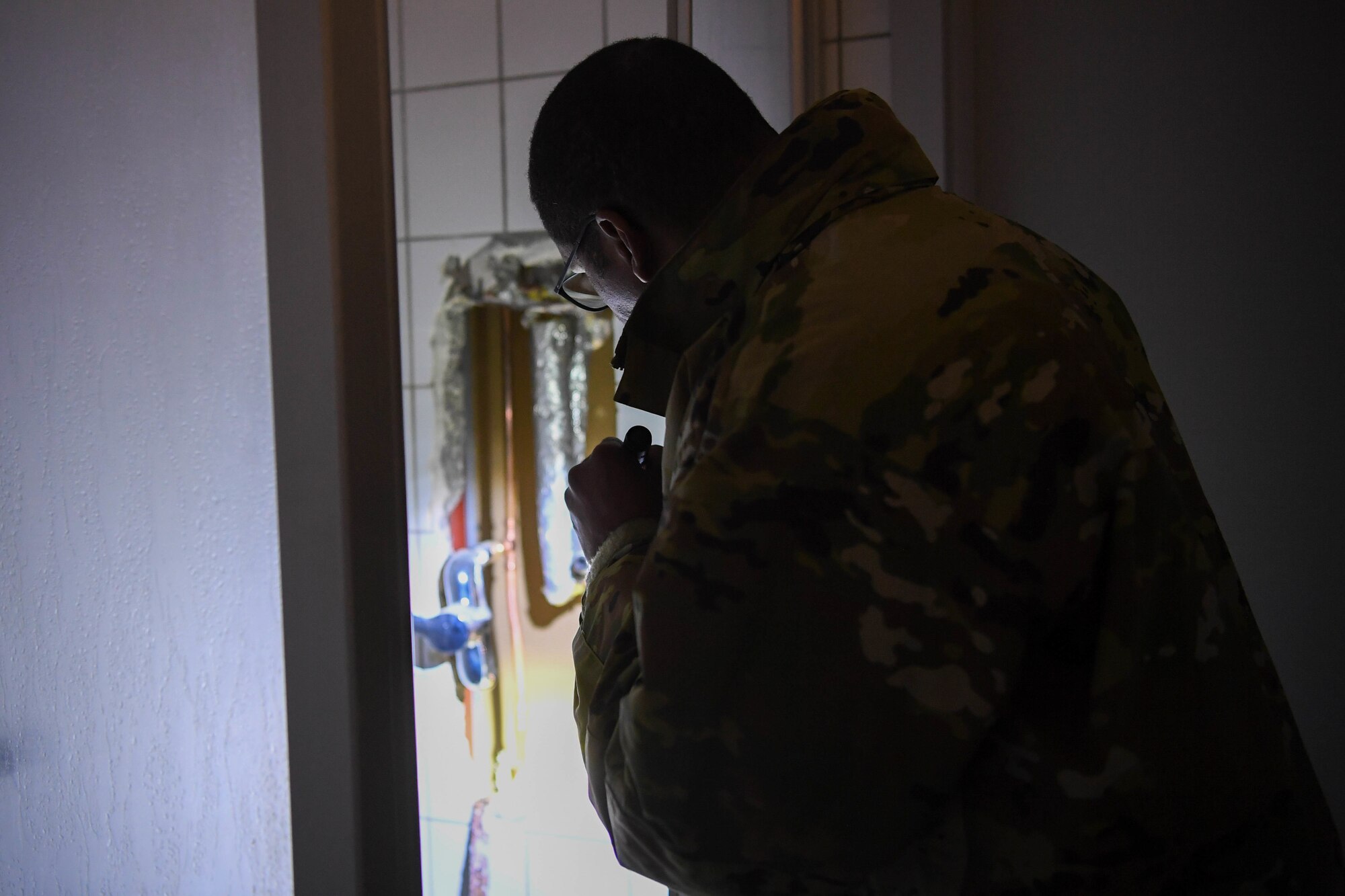 Airmen inspects bathroom