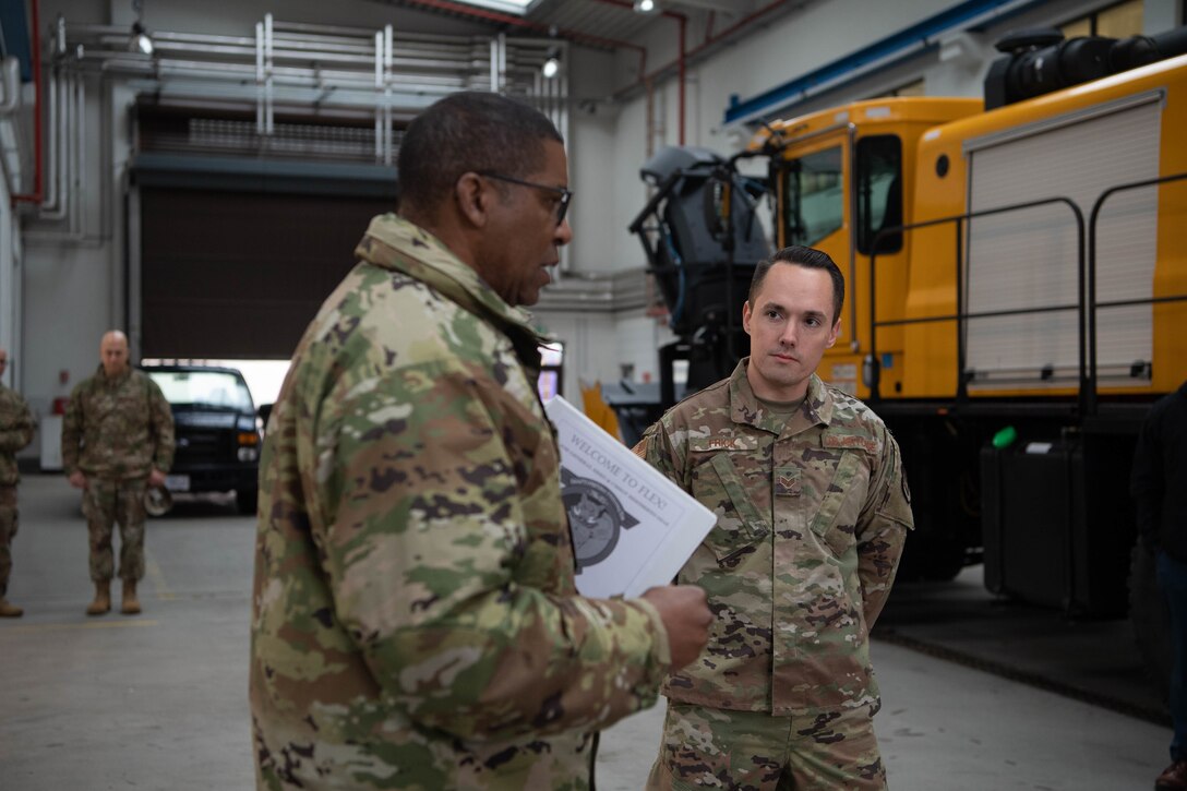 Airmen speak with Major General