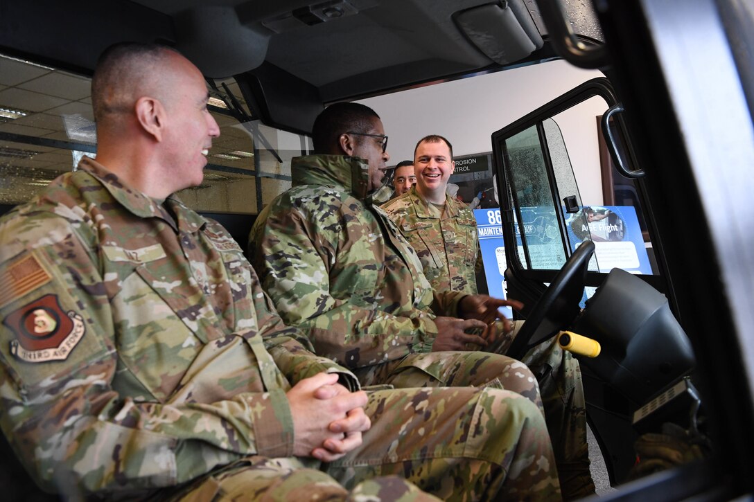 Airmen speak inside vehicle