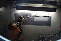 The Multifunctional Automated Repair System (MARS) performs the grinding function capability.