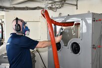 Pennsylvania State University’s Research and Development Engineer Tony Naccarelli performs a particle check to see the amount of particles that are being created during the cold spray operation.