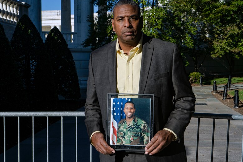 U.S. Army Veteran Charles Ross, U.S. Army Corps of Engineers, Baltimore District, Washington Aqueduct contract maintenance specialist, holds his official photo during a Veteran’s Day tribute at the Arlington National Cemetery in Arlington, Va., Oct. 22, 2021. Veterans Day celebrates the patriotism, service, and sacrifice of all who have served in the U.S. Military. (U.S. Army photo by Greg Nash)