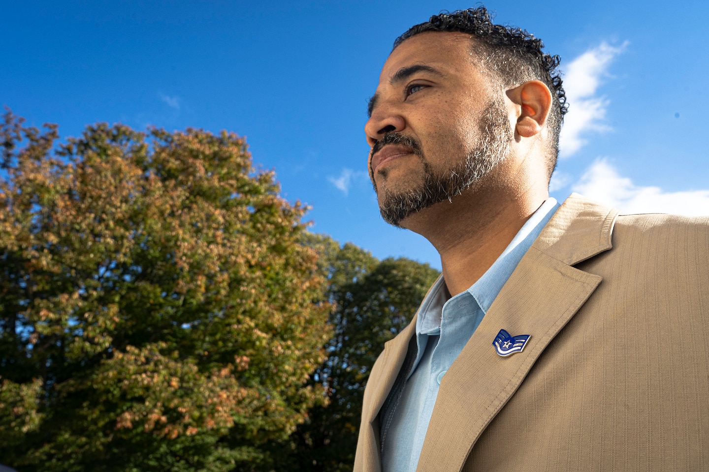 U.S. Air Force Veteran Juan Baret, U.S. Army Corps of Engineers, Baltimore District, engineering technician, dons an Air Force staff sergeant insignia pin during a Veteran’s Day tribute at the Arlington National Cemetery in Arlington, Va., Oct. 22, 2021. Baret and USACE Baltimore visited the cemetery’s Tomb of the Unknown Soldier, a sacred memorial site and grave for three unknown American service members. The burial grounds connect visitors with the legacy of the United States Armed Forces throughout our nation’s history. (U.S. Army photo by Greg Nash)