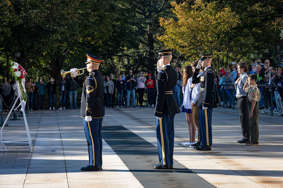 Sentinels from the 3rd U.S. Infantry Regiment render honors during a bugle call of Taps at the Arlington National Cemetery’s Tomb of the Unknown Soldier in Arlington, Va., Oct. 22, 2021. The bugle call of Taps has had a long association with Arlington National Cemetery. Today it is sounded at the many daily interments at Arlington and the Tomb of the Unknown Soldier when a wreath is presented in honor of the Unknowns by the many military, veteran, civic, fraternal, school, and other organizations that travel to Washington to pay homage. (U.S. Army photo by Greg Nash)